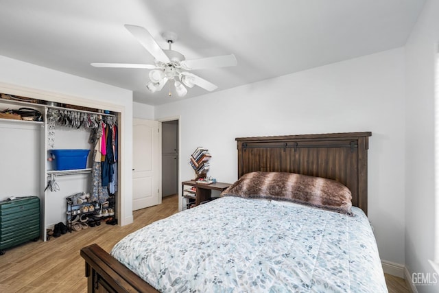 bedroom with a closet, a ceiling fan, and light wood finished floors