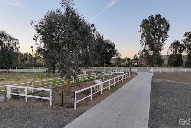 view of community featuring a rural view and fence