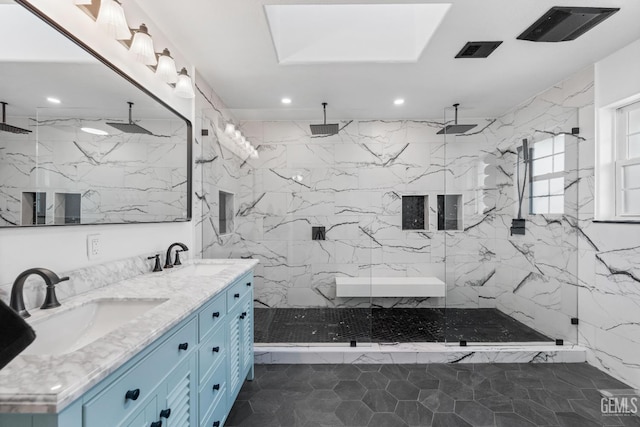 full bath with double vanity, recessed lighting, a marble finish shower, and a sink