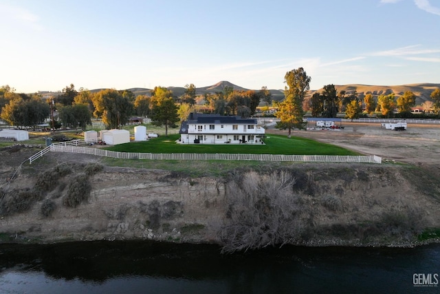 birds eye view of property featuring a water and mountain view