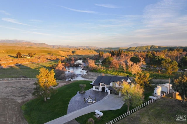 bird's eye view with a water and mountain view