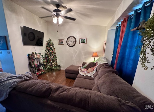 living room featuring ceiling fan and wood-type flooring