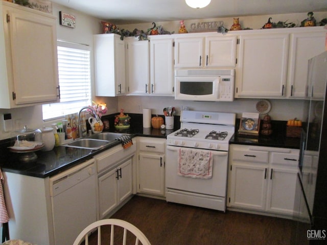 kitchen featuring white cabinetry, white appliances, sink, and dark wood-type flooring