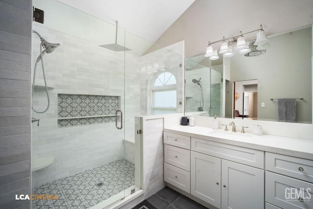 10005 Valley Forest Ct, Bakersfield, CA 93311 - bathroom featuring vanity, vaulted ceiling, tile patterned flooring, and a stall shower