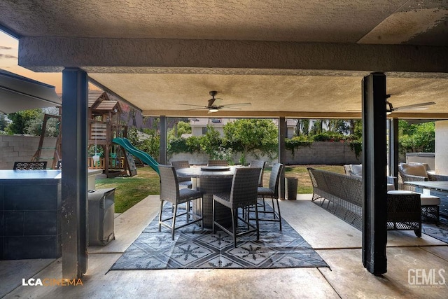 10005 Valley Forest Ct, Bakersfield, CA 93311 - view of patio / terrace with a fenced backyard, ceiling fan, a playground, and outdoor dining space