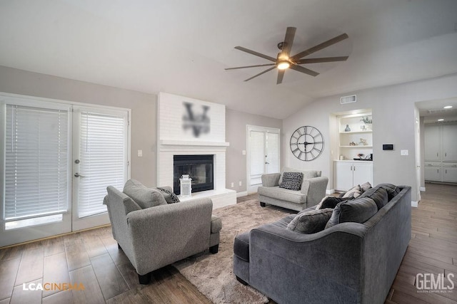 10005 Valley Forest Ct, Bakersfield, CA 93311 - living area featuring ceiling fan, lofted ceiling, visible vents, and wood finished floors