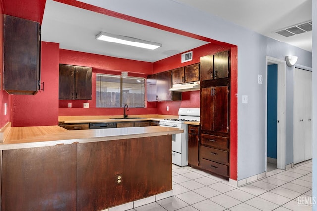2617 Auburn Ct, Bakersfield, CA 93306 - kitchen with white range with gas stovetop, under cabinet range hood, black dishwasher, a peninsula, and light countertops