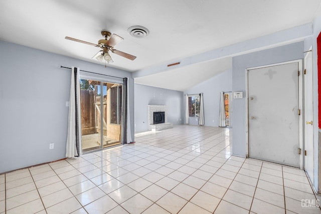 2617 Auburn Ct, Bakersfield, CA 93306 - unfurnished living room featuring ceiling fan, a fireplace, lofted ceiling, and light tile patterned flooring