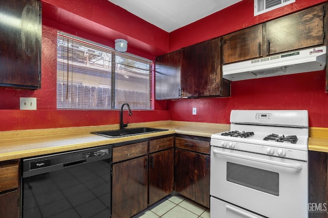 2617 Auburn Ct, Bakersfield, CA 93306 - kitchen featuring black dishwasher, white gas stove, under cabinet range hood, and light countertops