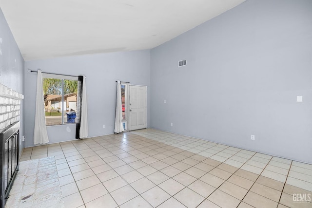 2617 Auburn Ct, Bakersfield, CA 93306 - unfurnished living room featuring light tile patterned floors and high vaulted ceiling