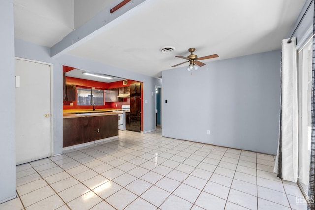 2617 Auburn Ct, Bakersfield, CA 93306 - kitchen with white electric stove, a ceiling fan, a peninsula, light countertops, and open floor plan