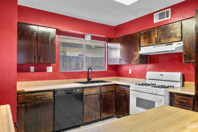 2617 Auburn Ct, Bakersfield, CA 93306 - kitchen with black dishwasher, under cabinet range hood, white range with gas cooktop, a textured wall, and light countertops