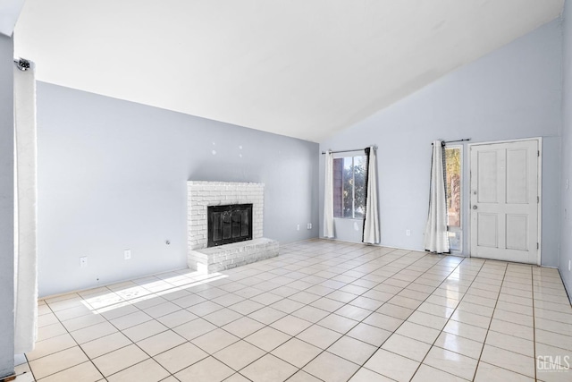 2617 Auburn Ct, Bakersfield, CA 93306 - unfurnished living room featuring high vaulted ceiling, light tile patterned floors, and a brick fireplace