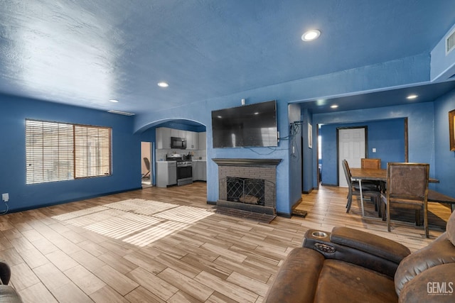 unfurnished living room with a fireplace