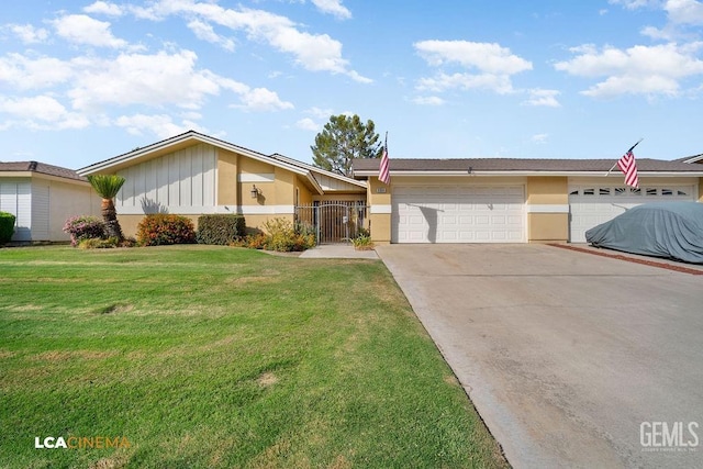 single story home with a front yard and a garage