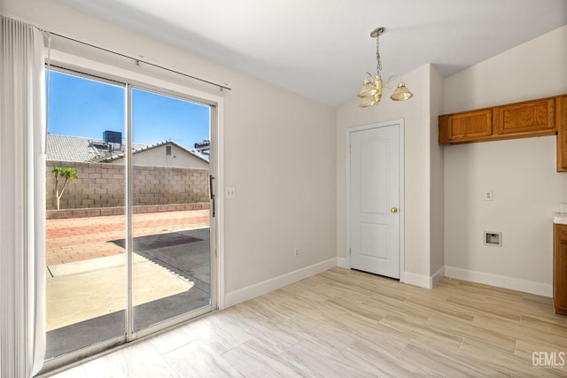 3410 Kimmie Rachelle Ct, Bakersfield, CA 93313 - unfurnished dining area with a chandelier, lofted ceiling, and light wood-style flooring