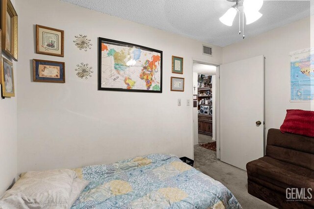 800 Lexington St Unit 28, Delano, CA 93215 - bedroom with carpet floors and a textured ceiling