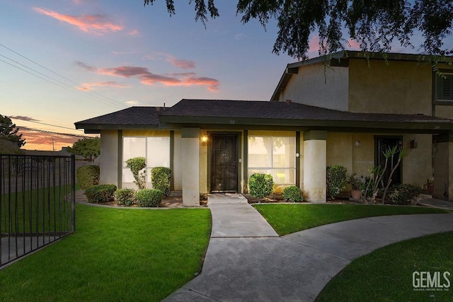 800 Lexington St Unit 28, Delano, CA 93215 - view of front facade featuring stucco siding and a shingled roof