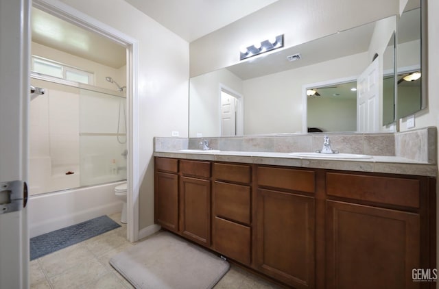 7215 Pine Flat Dr, Bakersfield, CA 93311 - full bathroom featuring toilet, double vanity, bathing tub / shower combination, and tile patterned floors