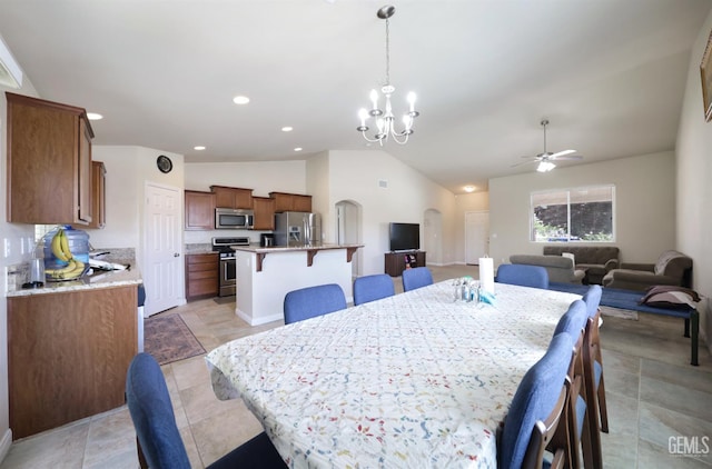7215 Pine Flat Dr, Bakersfield, CA 93311 - dining room featuring arched walkways, ceiling fan, vaulted ceiling, a chandelier, and recessed lighting