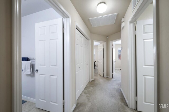 7215 Pine Flat Dr, Bakersfield, CA 93311 - corridor featuring light colored carpet and baseboards