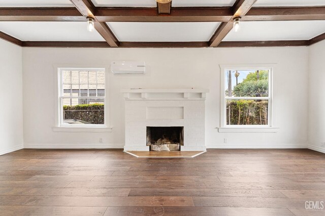 1940 S La Salle Ave, Los Angeles, CA 90018 - unfurnished living room featuring coffered ceiling, healthy amount of natural light, hardwood / wood-style flooring, beamed ceiling, and an AC wall unit