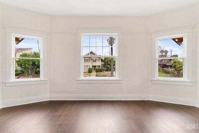 1940 S La Salle Ave, Los Angeles, CA 90018 - spare room with dark wood-style flooring and baseboards