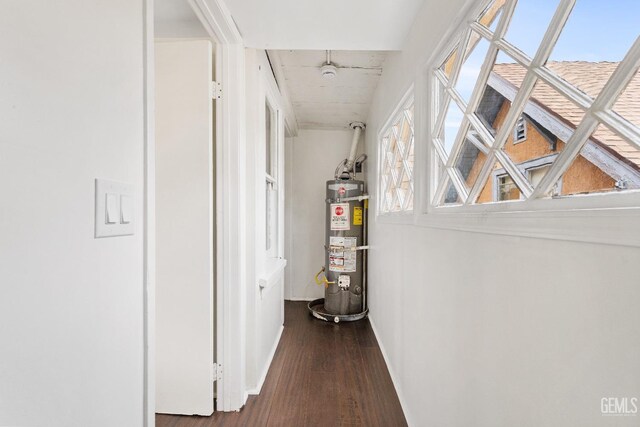 1940 S La Salle Ave, Los Angeles, CA 90018 - hall featuring water heater, baseboards, and dark wood-style flooring
