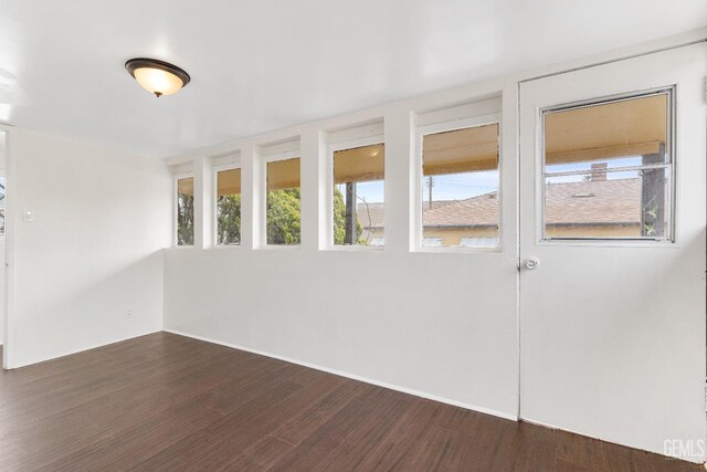 1940 S La Salle Ave, Los Angeles, CA 90018 - spare room featuring dark wood-style floors and baseboards