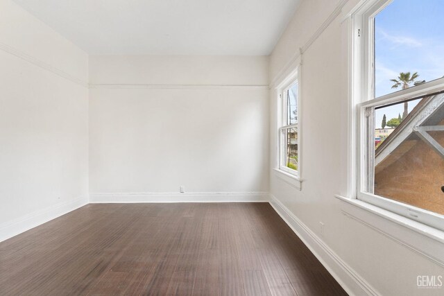 1940 S La Salle Ave, Los Angeles, CA 90018 - unfurnished room featuring dark wood-style floors and baseboards