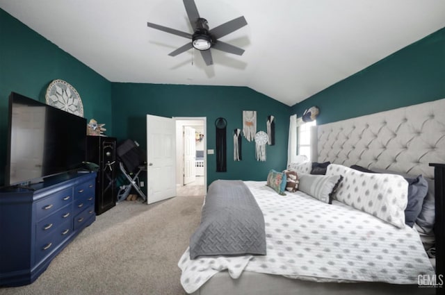 bedroom with a ceiling fan, vaulted ceiling, and light colored carpet