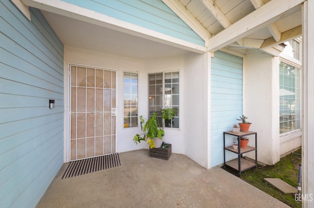 property entrance featuring a patio area