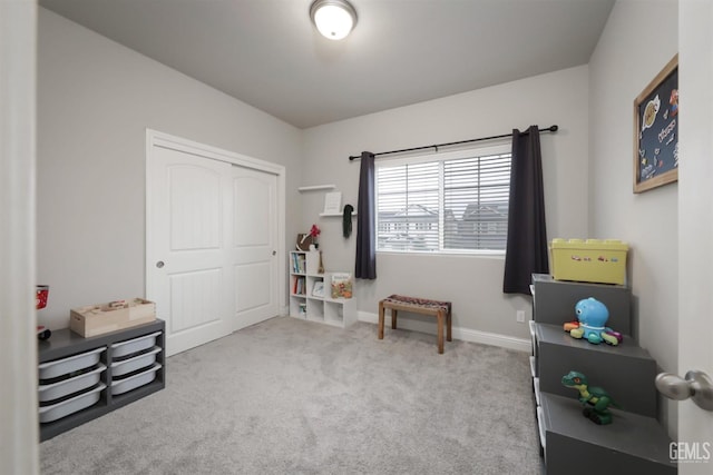 interior space with light carpet and baseboards