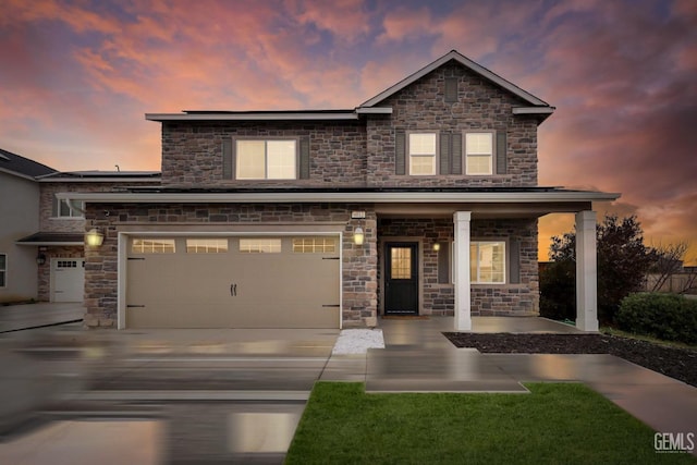 traditional-style home featuring covered porch and concrete driveway