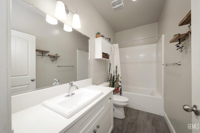 full bath featuring toilet, shower / tub combo, wood finished floors, vanity, and visible vents