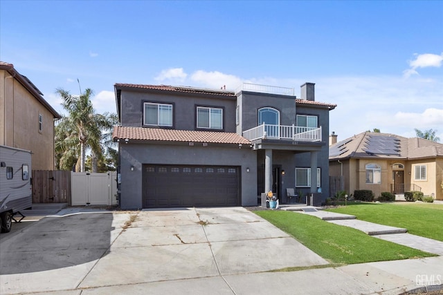 437 Rian Noelle Ct, Bakersfield, CA 93308 - mediterranean / spanish-style home featuring a gate, a balcony, a chimney, and stucco siding