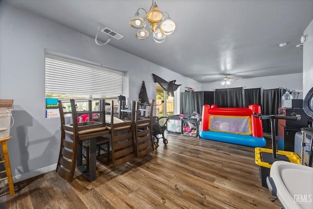 437 Rian Noelle Ct, Bakersfield, CA 93308 - dining room with wood finished floors, ceiling fan, plenty of natural light, and a chandelier