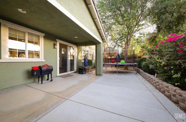 11102 Patagonia Way, Bakersfield, CA 93306 - view of patio / terrace featuring a trampoline and area for grilling