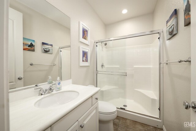 11102 Patagonia Way, Bakersfield, CA 93306 - bathroom featuring a shower stall, vanity, toilet, and tile patterned floors