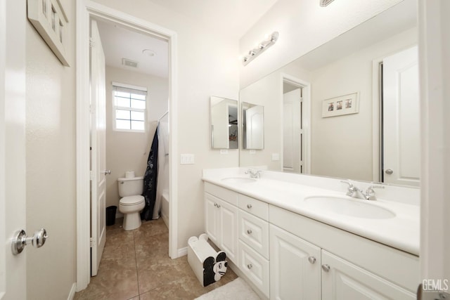 11102 Patagonia Way, Bakersfield, CA 93306 - bathroom with double vanity, toilet, tile patterned floors, and baseboards