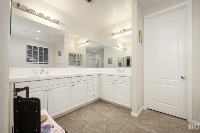 11102 Patagonia Way, Bakersfield, CA 93306 - bathroom with double vanity, a shower with door, and tile patterned floors