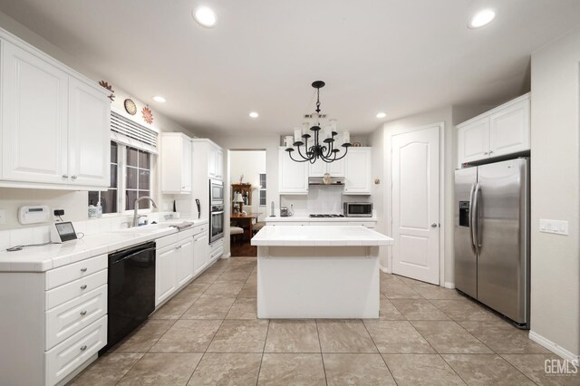 11102 Patagonia Way, Bakersfield, CA 93306 - kitchen with stainless steel appliances, a center island, a sink, tile countertops, and white cabinets