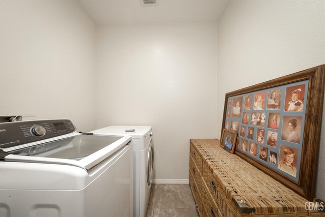 11102 Patagonia Way, Bakersfield, CA 93306 - washroom featuring washer and clothes dryer and baseboards