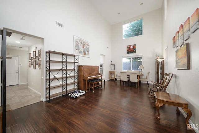 11102 Patagonia Way, Bakersfield, CA 93306 - sitting room featuring a towering ceiling, wood finished floors, and baseboards