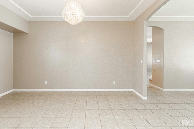 spare room with arched walkways, a chandelier, baseboards, and light tile patterned floors