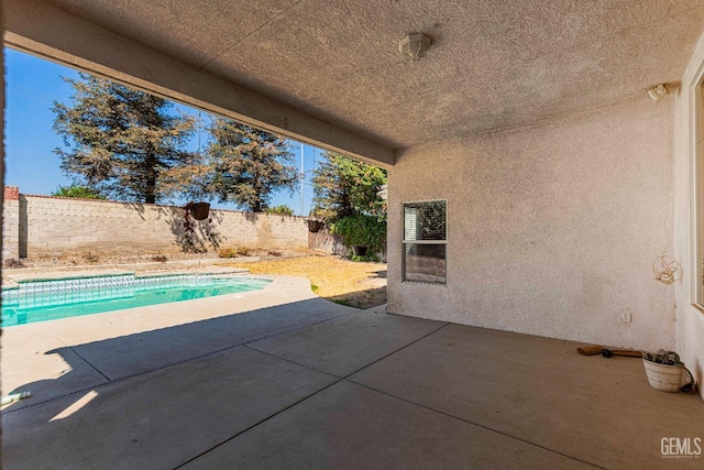 view of pool with a patio, a fenced backyard, and a fenced in pool