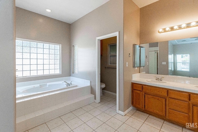 full bath featuring tile patterned floors, a garden tub, toilet, and a shower stall