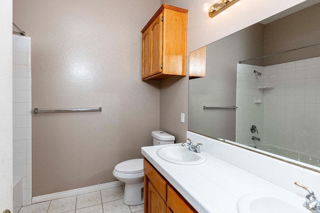 full bath featuring bathtub / shower combination, toilet, tile patterned flooring, and a sink