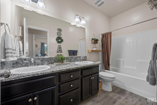 9008 Pine Breeze Ln, Shafter, CA 93263 - living area featuring ceiling fan, visible vents, wood finish floors, baseboards, and lofted ceiling