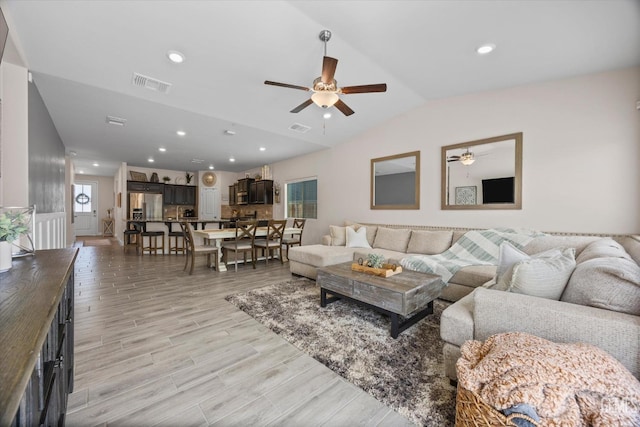 9008 Pine Breeze Ln, Shafter, CA 93263 - living room featuring visible vents, a ceiling fan, light wood finished floors, and vaulted ceiling
